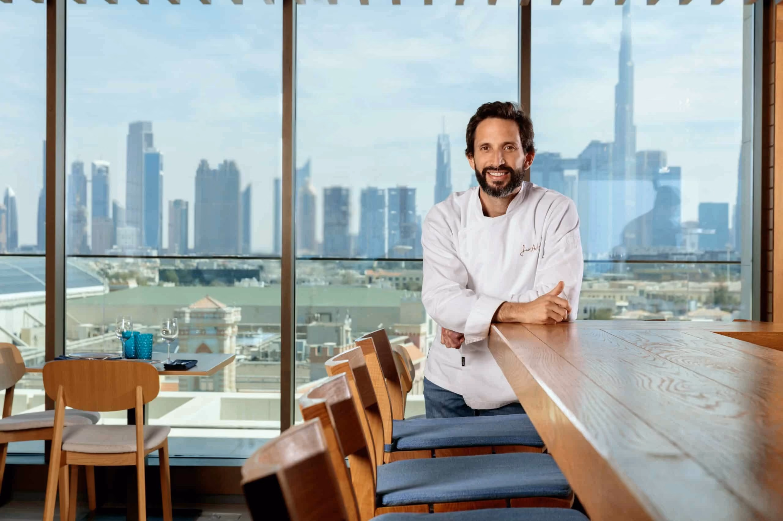jose avillez posing at the counter top of his restaurant tasca