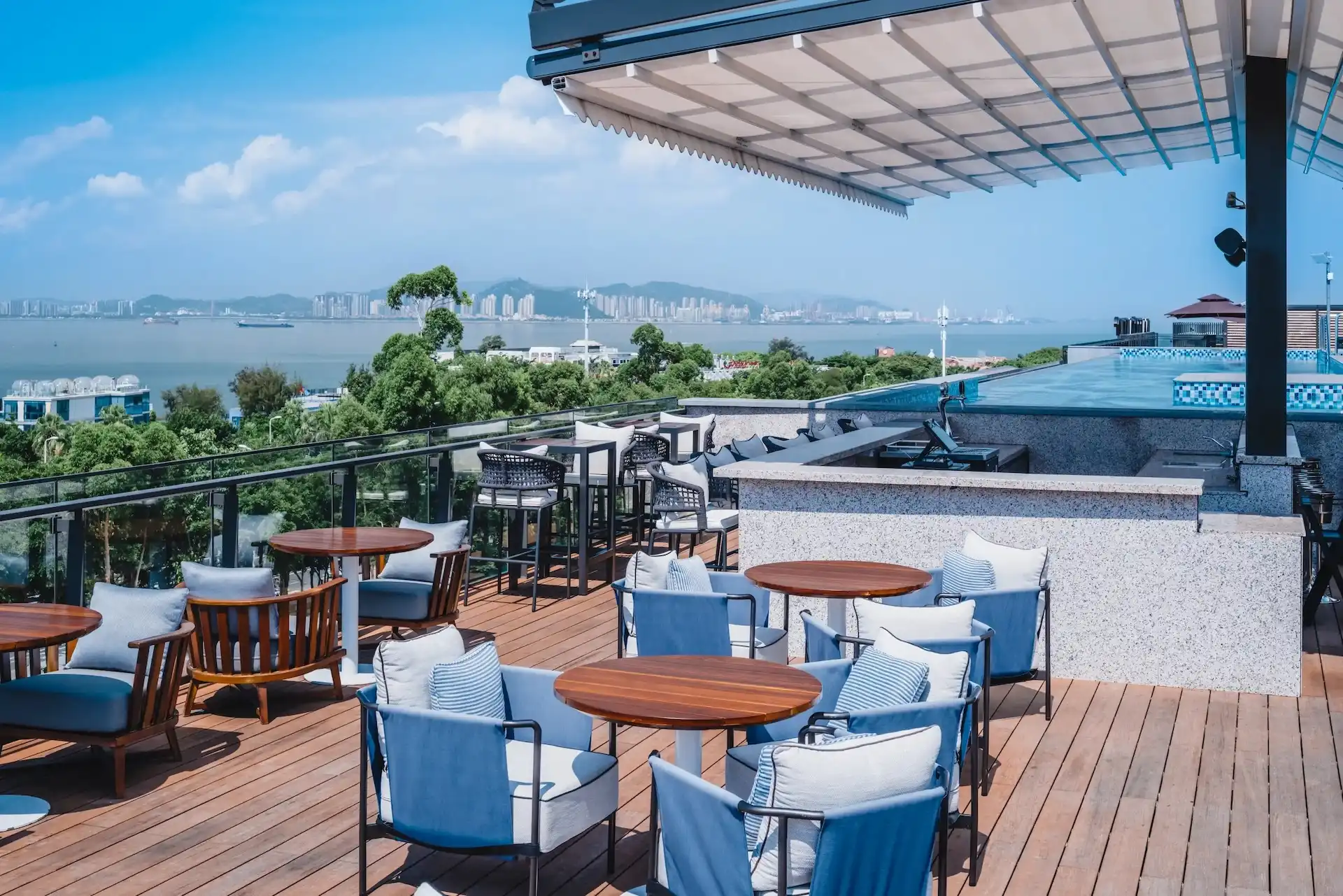 Hyatt Centric Xiamen rooftop bar terrace with ocean views, outdoor lounge seating and luxury coastal hotel design