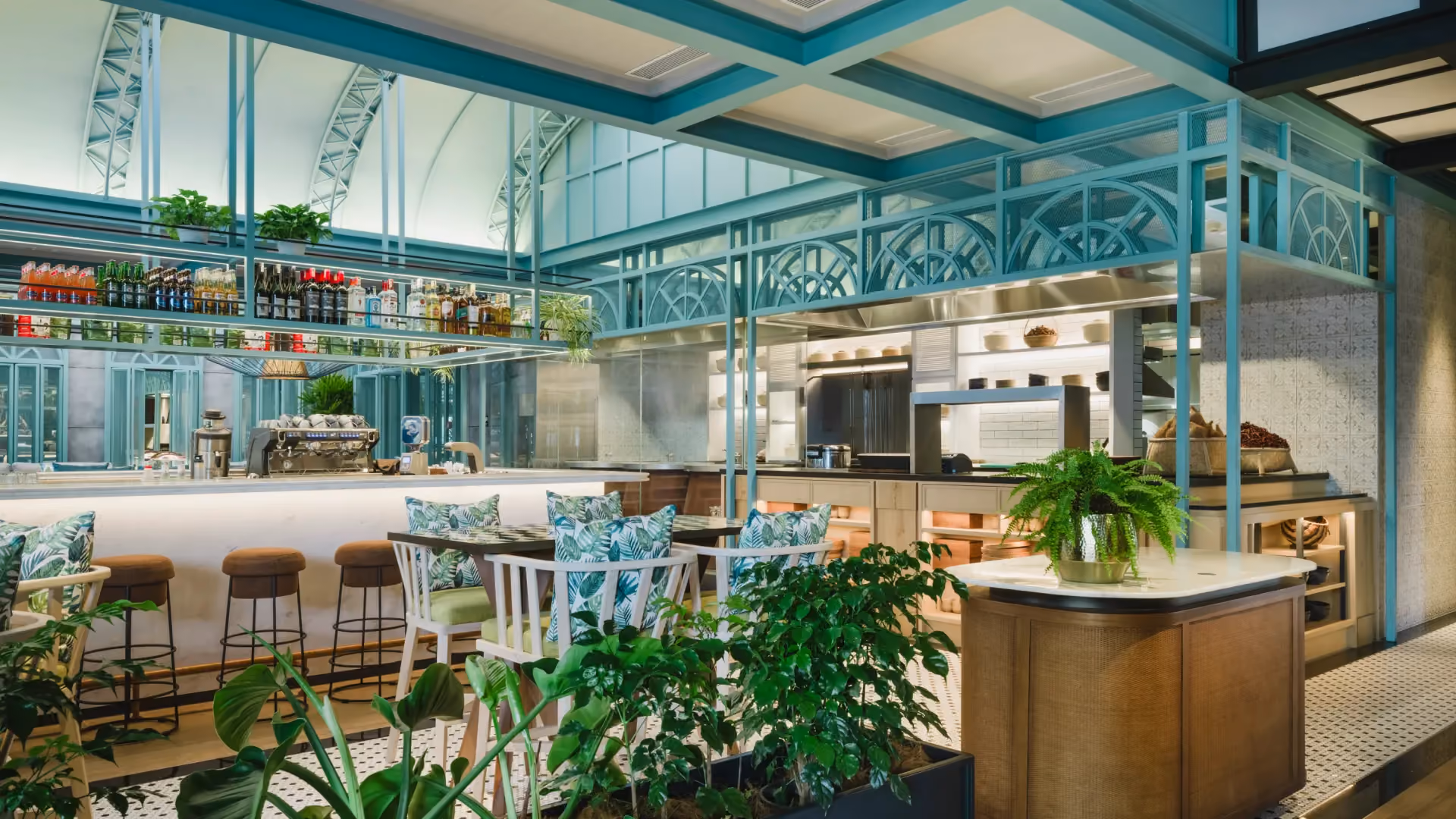 Tanburi Cafe at Hyatt Centric City Centre Kuala Lumpur, with a focal beverage bar, teal steelwork, bar stools and patterned seating