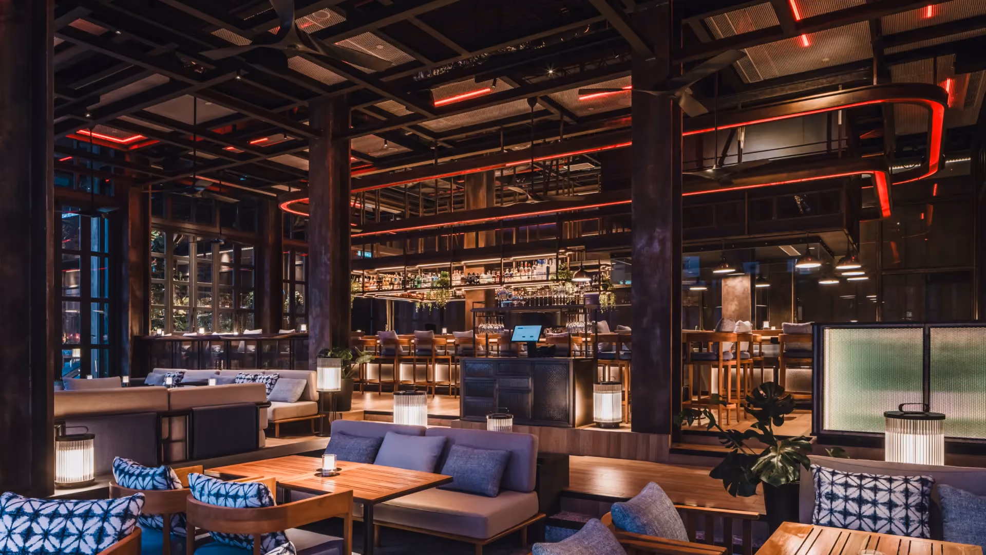 @21 Sky Bar at Hyatt Centric City Centre Kuala Lumpur, with blue lounge sofas, patterned cushions and red-lit steel gantries