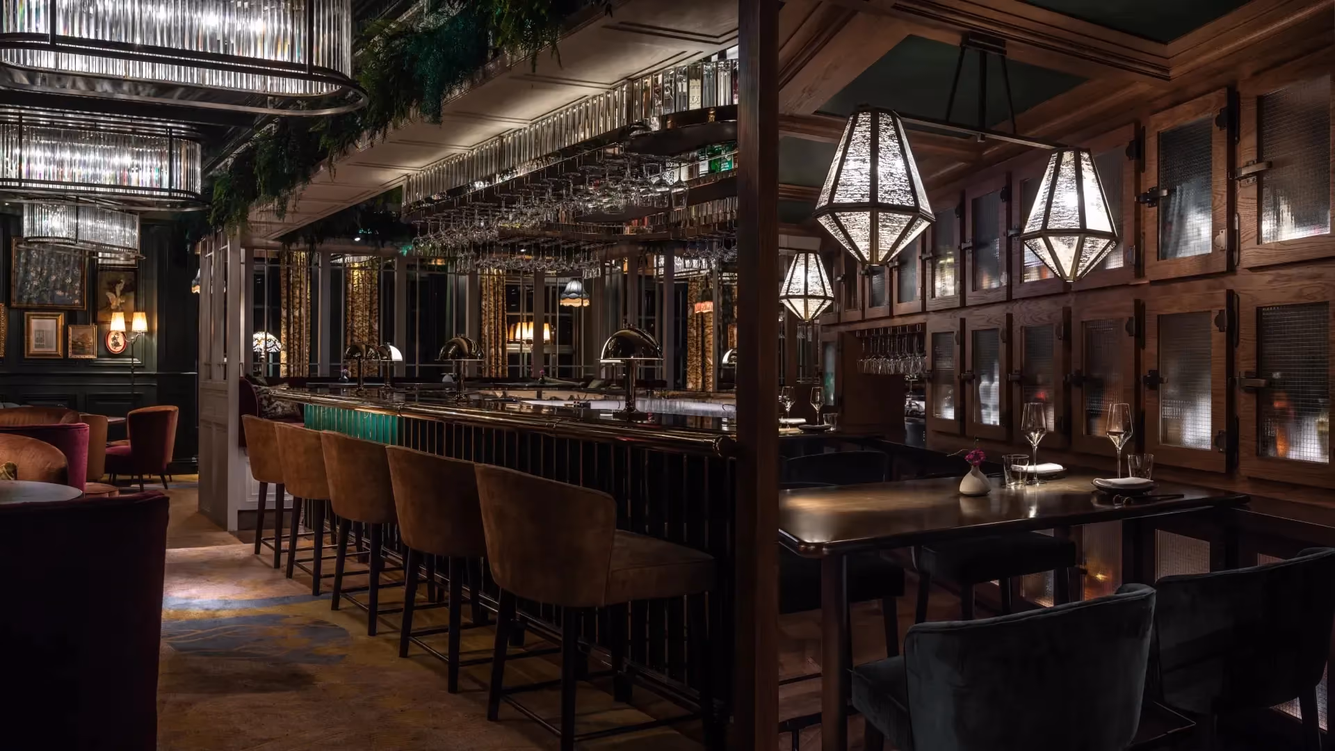 View from the whisky bar towards the main bar at The Aubrey, Mandarin Oriental Hong Kong, with lantern pendants and leather bar stools