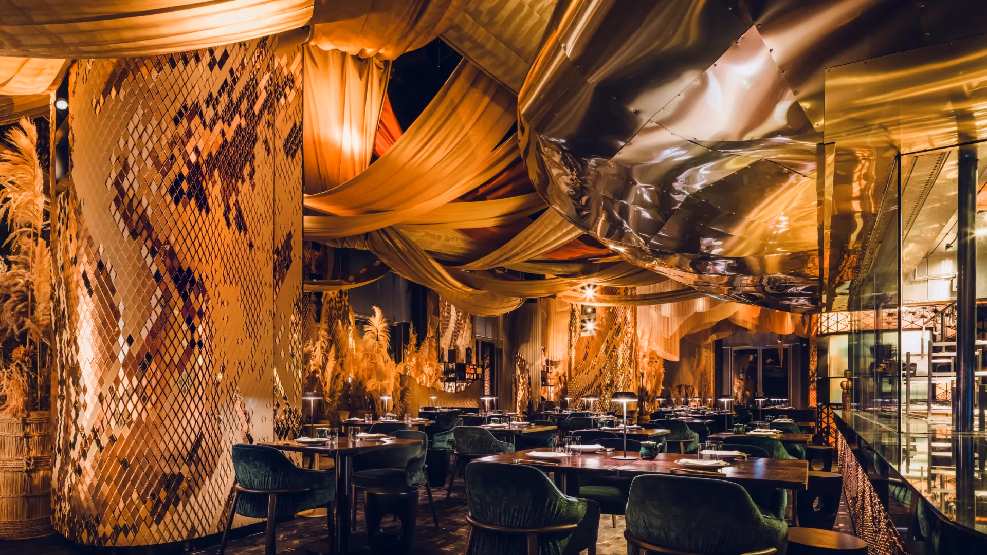 Giles Miller faceted gold tile column in the main dining room at Strawfire, Emirates Palace Abu Dhabi, beneath draped silk canopies