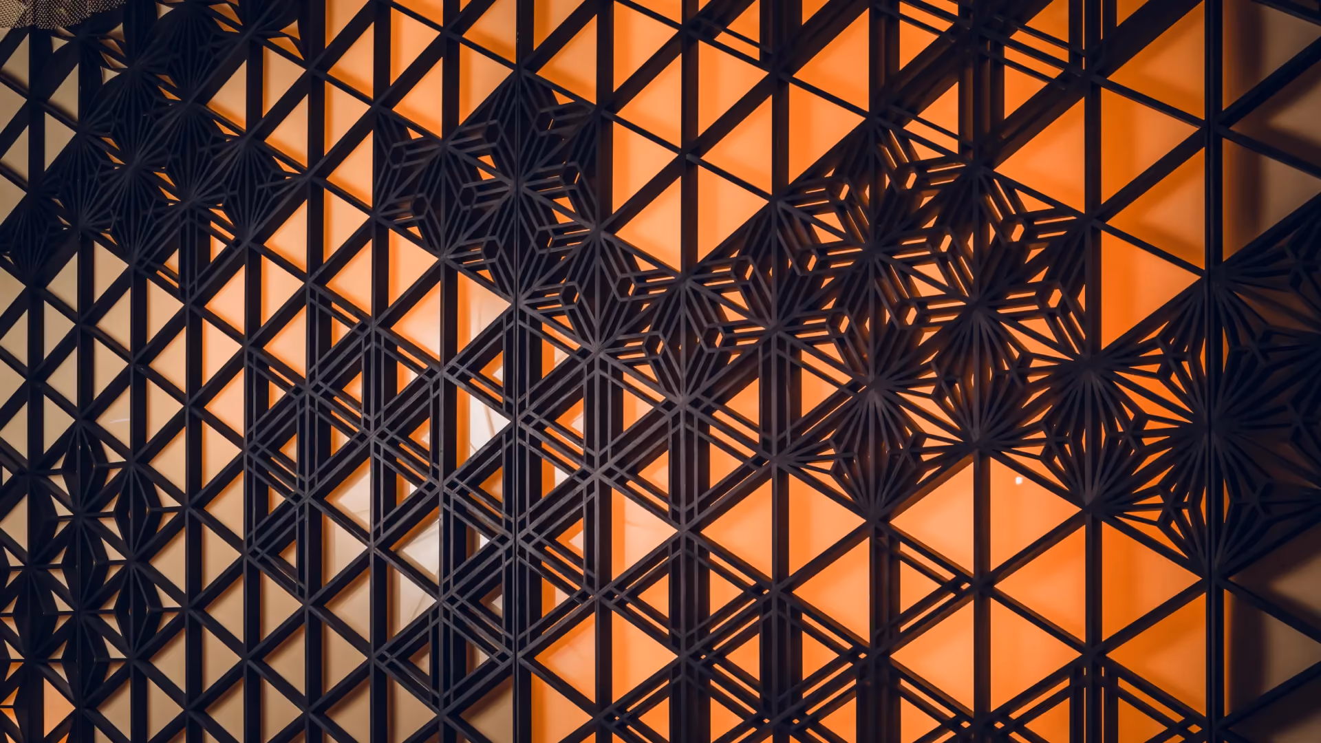 Close-up of the back-illuminated Kumiko wood screen geometry at Strawfire, Emirates Palace Abu Dhabi