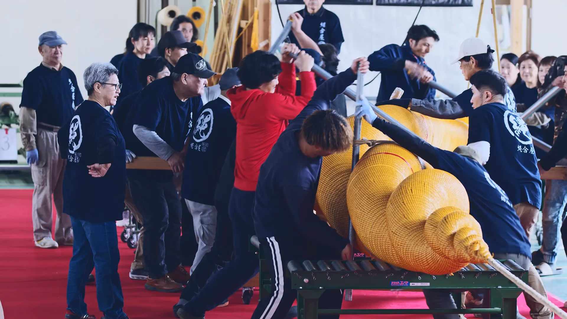 Artisans twisting the Shimenawa rope made for Strawfire's private dining room, one of the largest synthetic Shimenawa ropes in the world