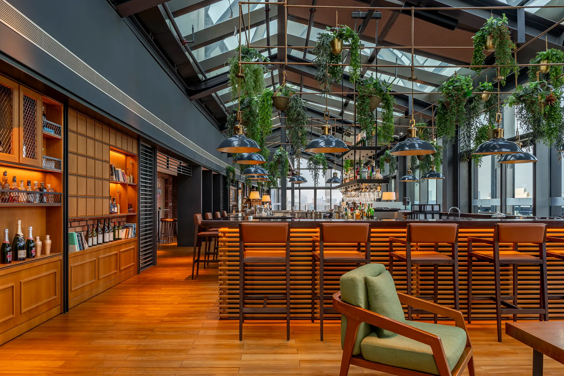 The Loft rooftop bar on level 23 of Hyatt Regency Hengqin with a glass roof and hanging greenery