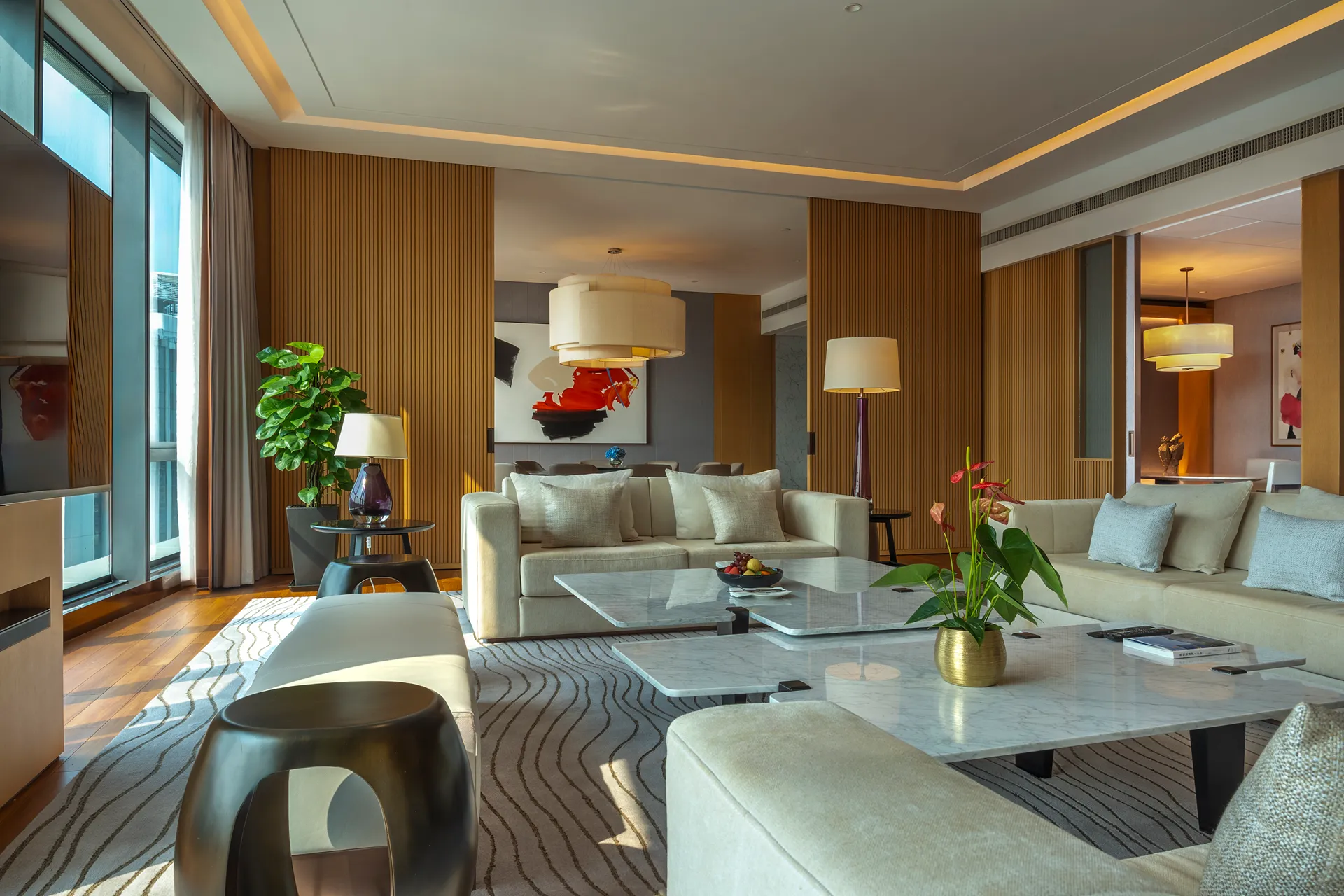 Presidential suite living room at Hyatt Regency Hengqin with timber walls and lounge seating