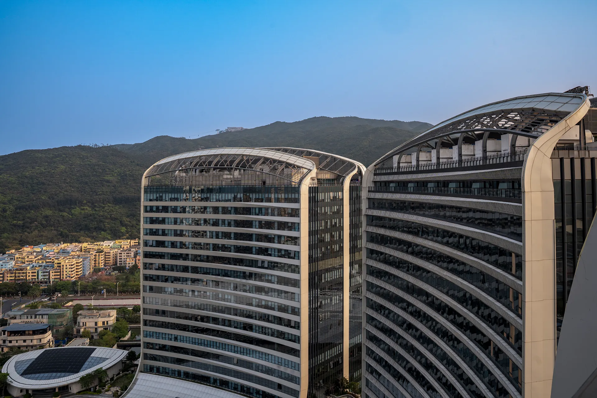 Exterior of Hyatt Regency Hengqin, Zhuhai, showing the hotel's curved towers