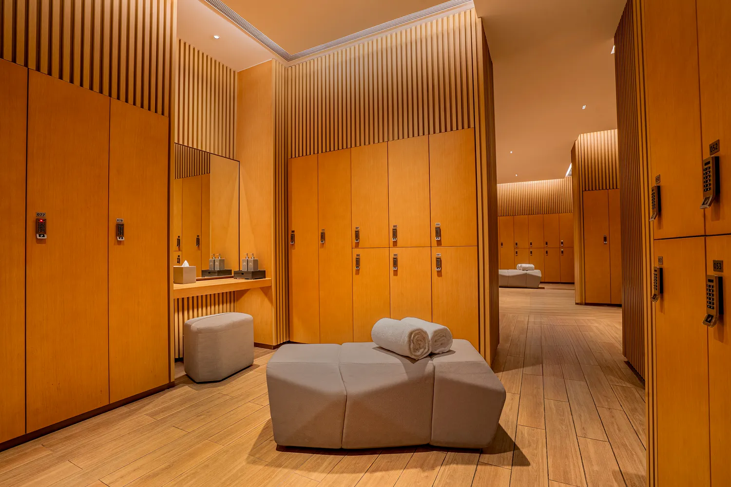 Changing room at Hyatt Regency Hengqin with timber lockers and lounge seating