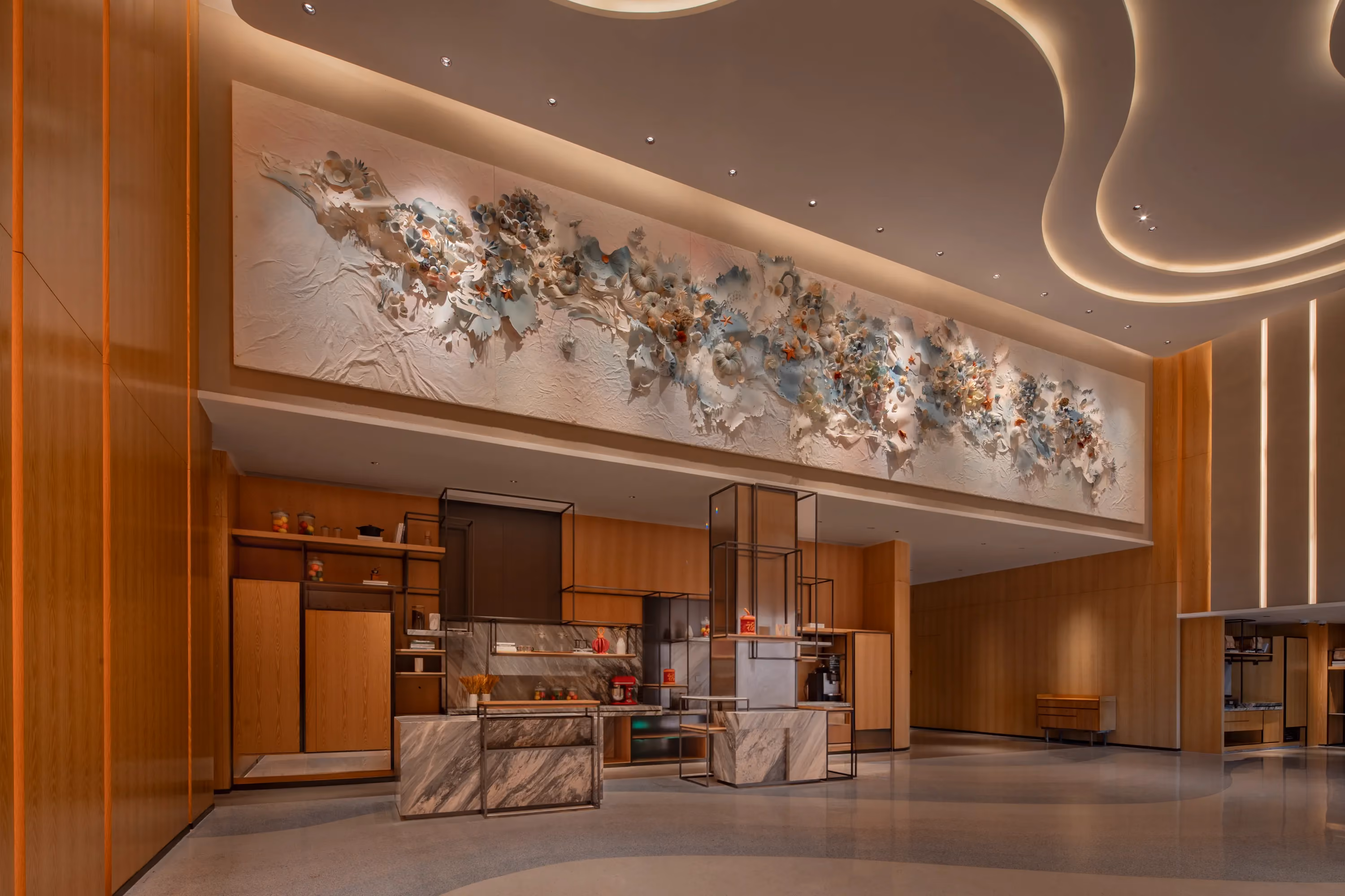 Ballroom foyer refreshment counter at Hyatt Regency Ocean Paradise Resort, beneath a large relief artwork