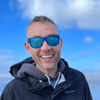 Portrait of woman with long curly hair in satin floral top John Driven Products Amazon Ebay Gorilla ROI review