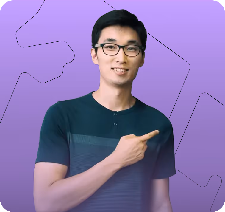 Young man with glasses smiling and pointing to his right against a purple background with puzzle piece outlines.