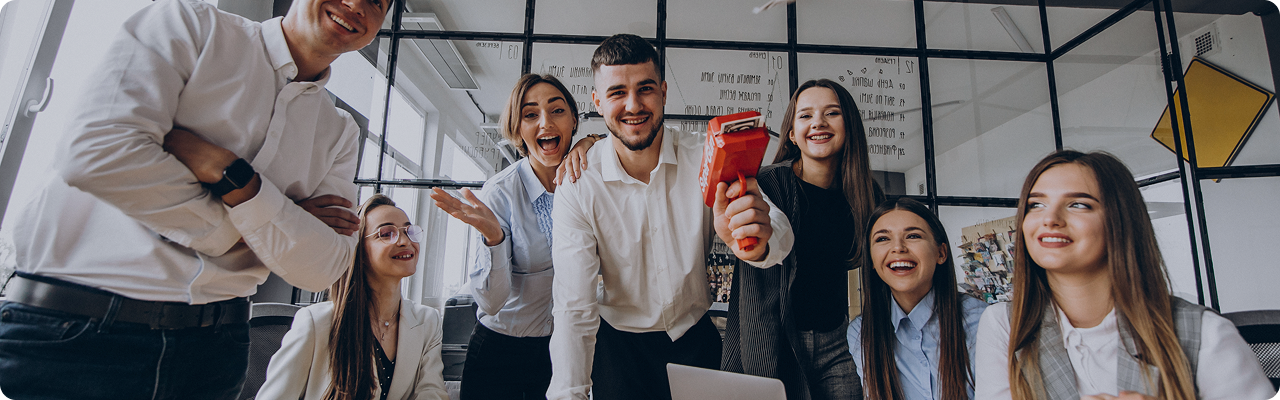 Unico team celebrating together in the office