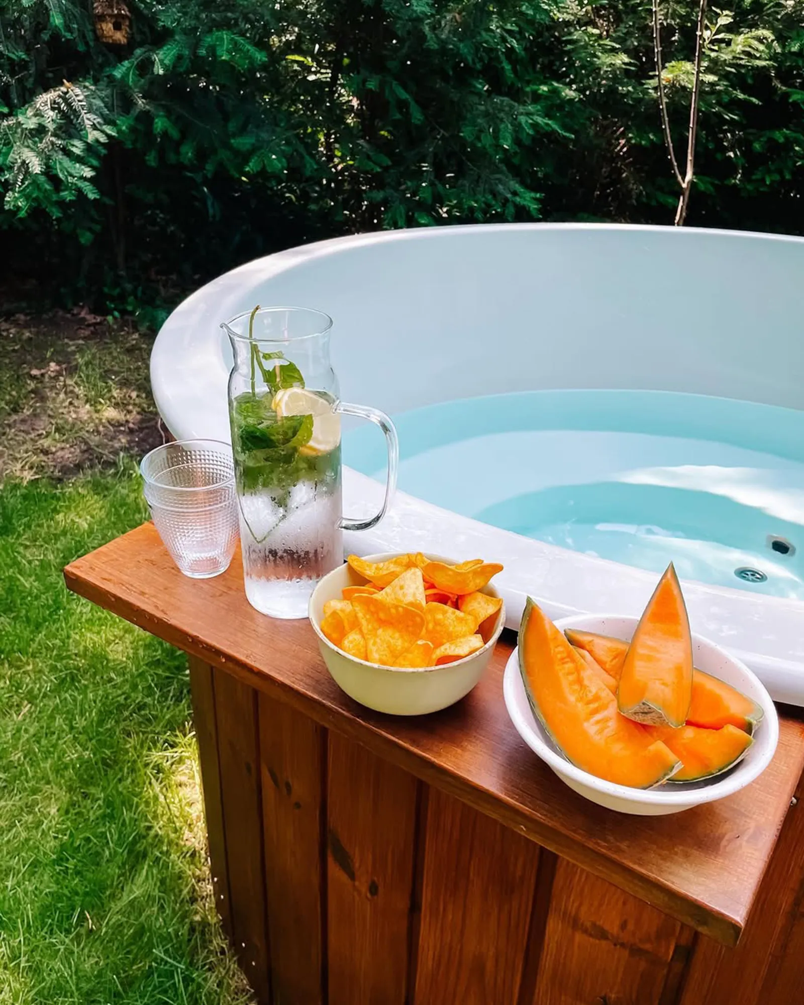 What are the dimensions of the different models of hot tubs?