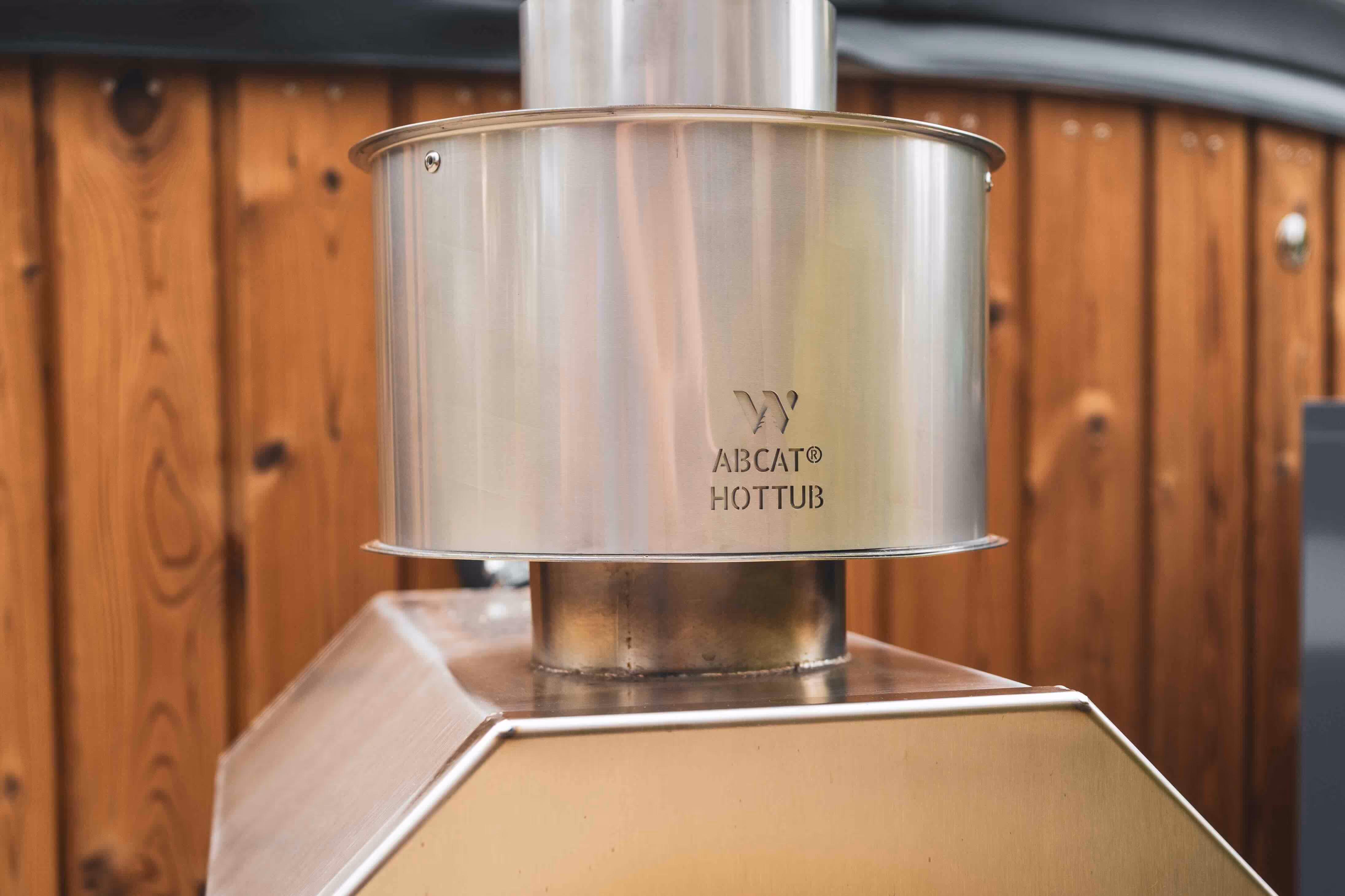 Can I reduce the smell and smoke from my hot tub wood stove?