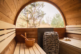 How do you install the interior in the self-build sauna with a wooden back wall or half a panorama?