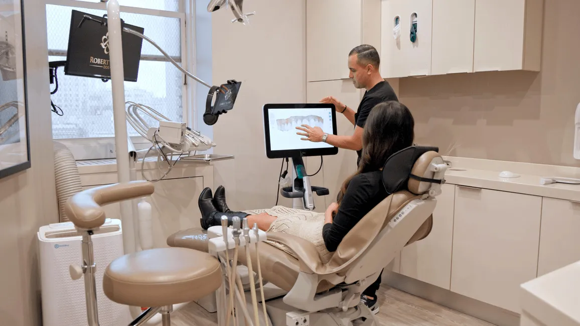 Dr. Soto, one of the best cosmetic dentists in San Francisco, consults with a patient about natural-looking dental veneers