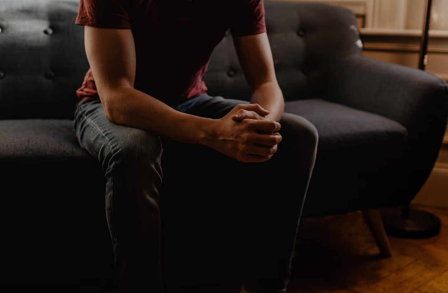 the hero image on the home page for Ketamine Therapy. A man in a seated yet, vulnerable position.