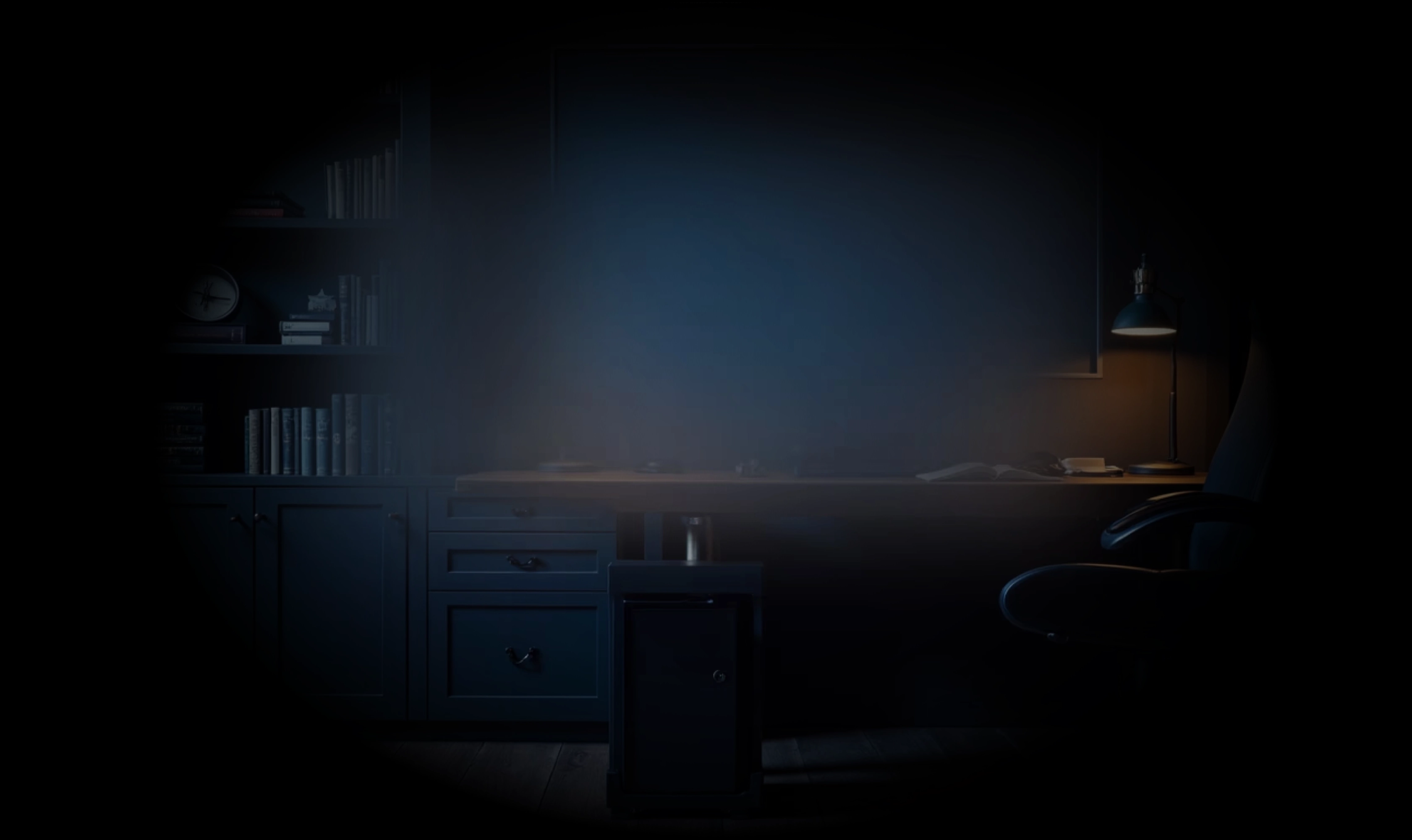 Dark home office with black bookshelves filled with books, a desk with a lamp, and a black swivel chair on wooden flooring.