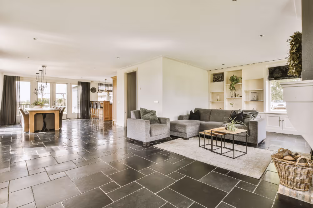 A room with dark tile floor.