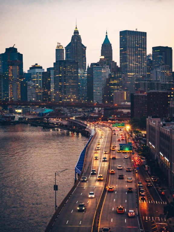 A view of NYC city skyline from a bridge.