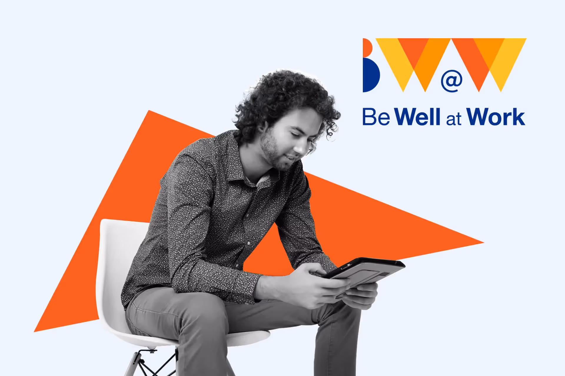 Be Well @ Work happy staff looking at digital tablet