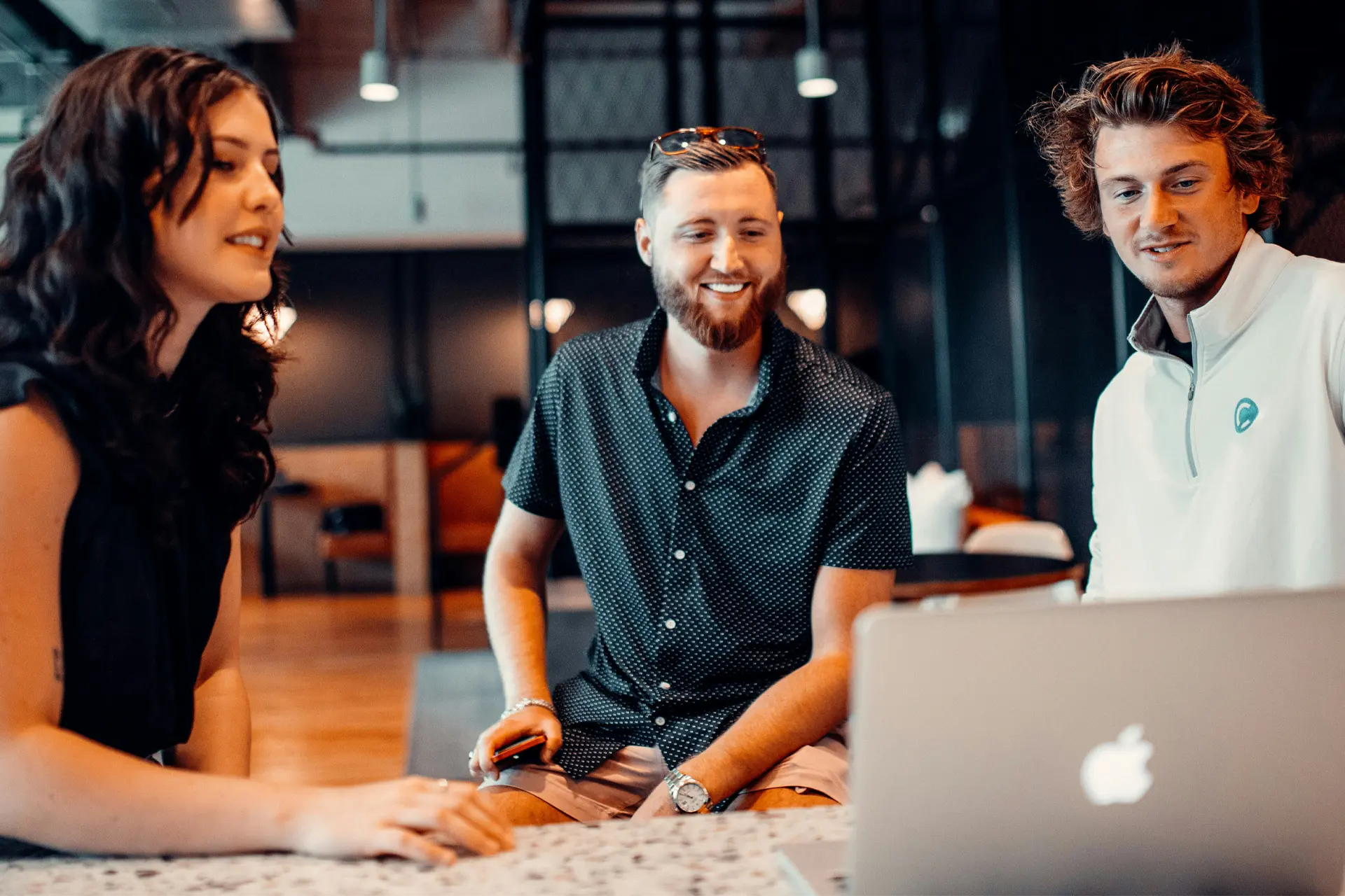 Three work colleagues collaborating on a project
