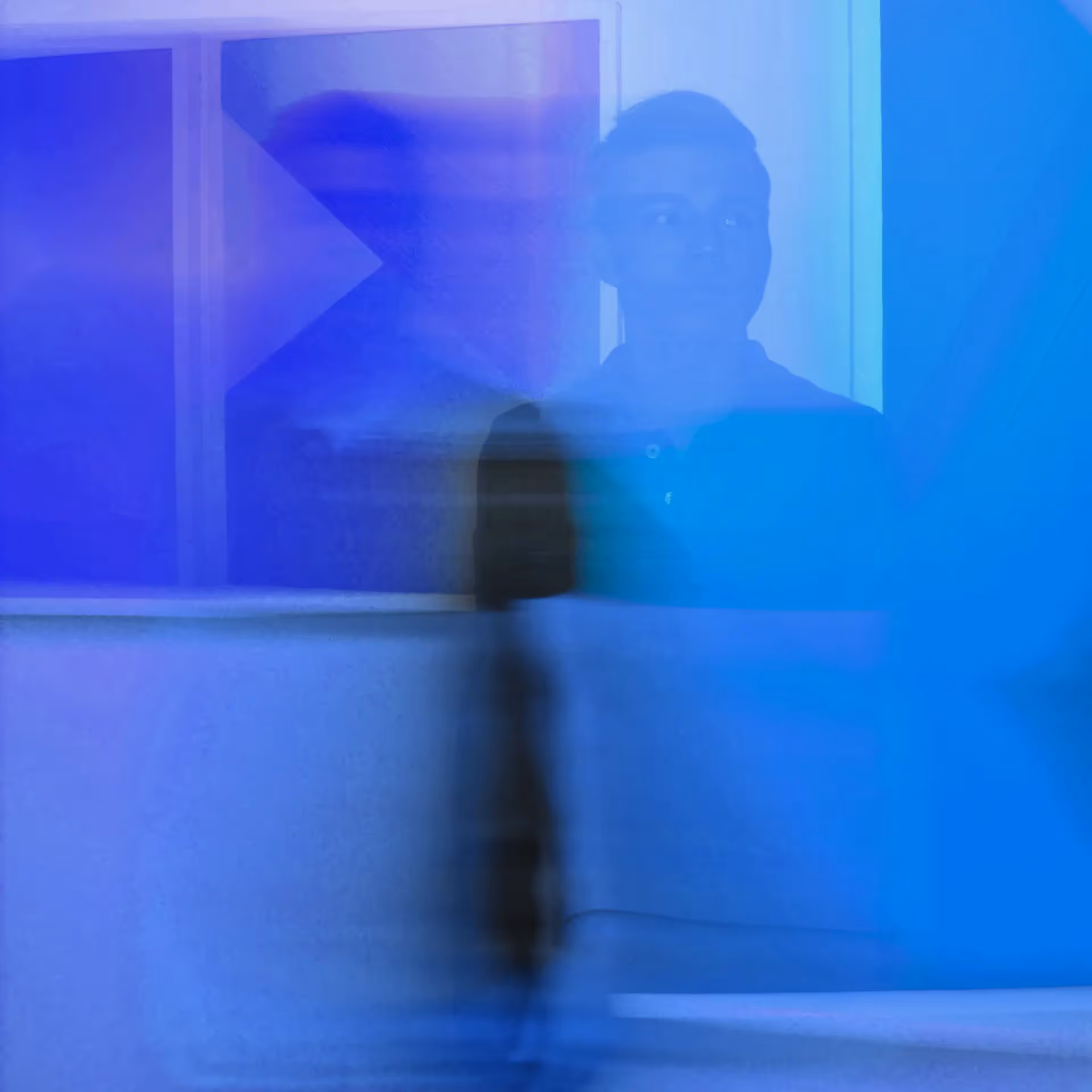Male blurred with blue hues