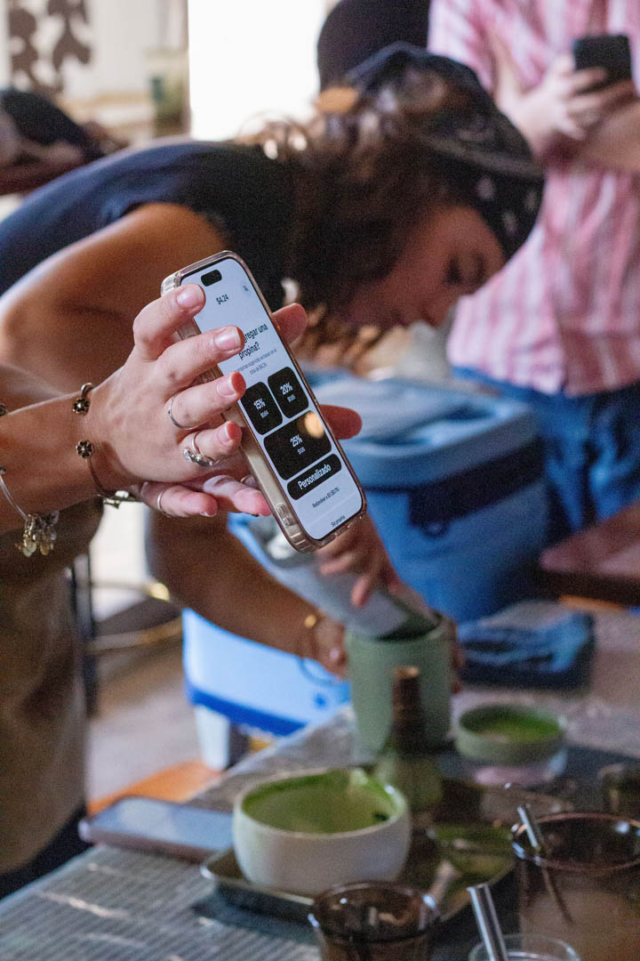 An employee completing a customer checkout on mobile app.