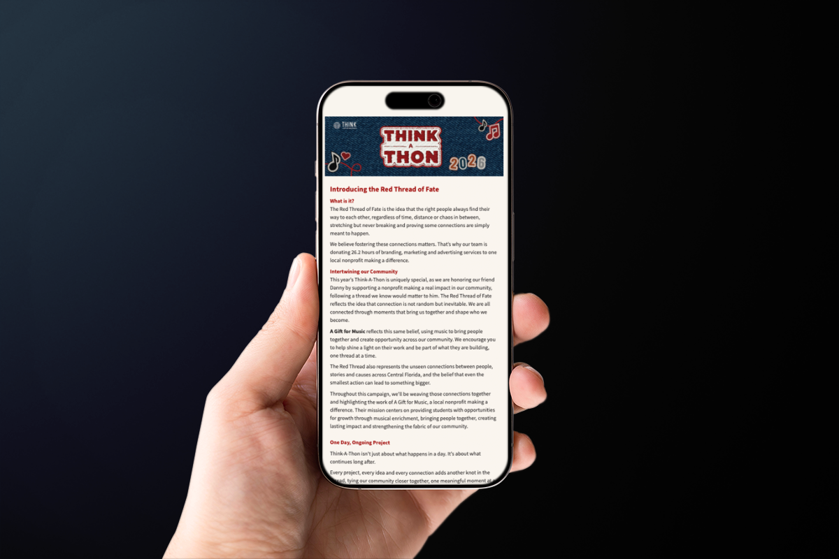 A hand holding an iPhone with an email design for Think-A-Thon.