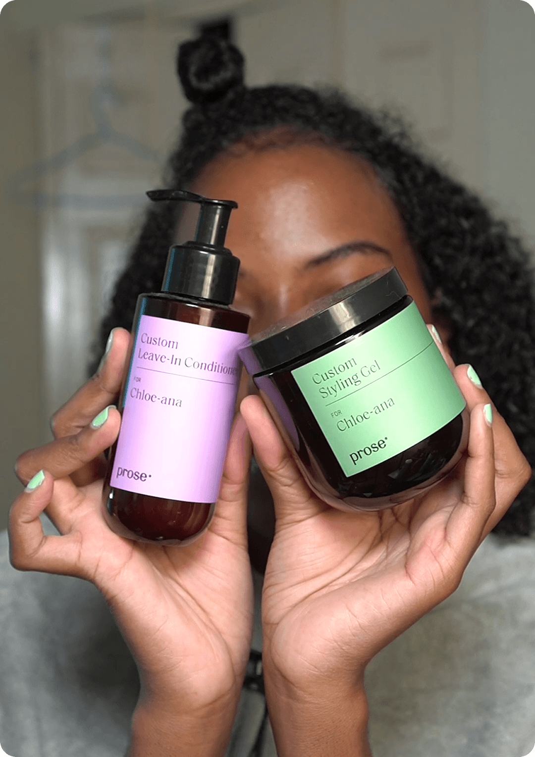 woman holding prose haircare product