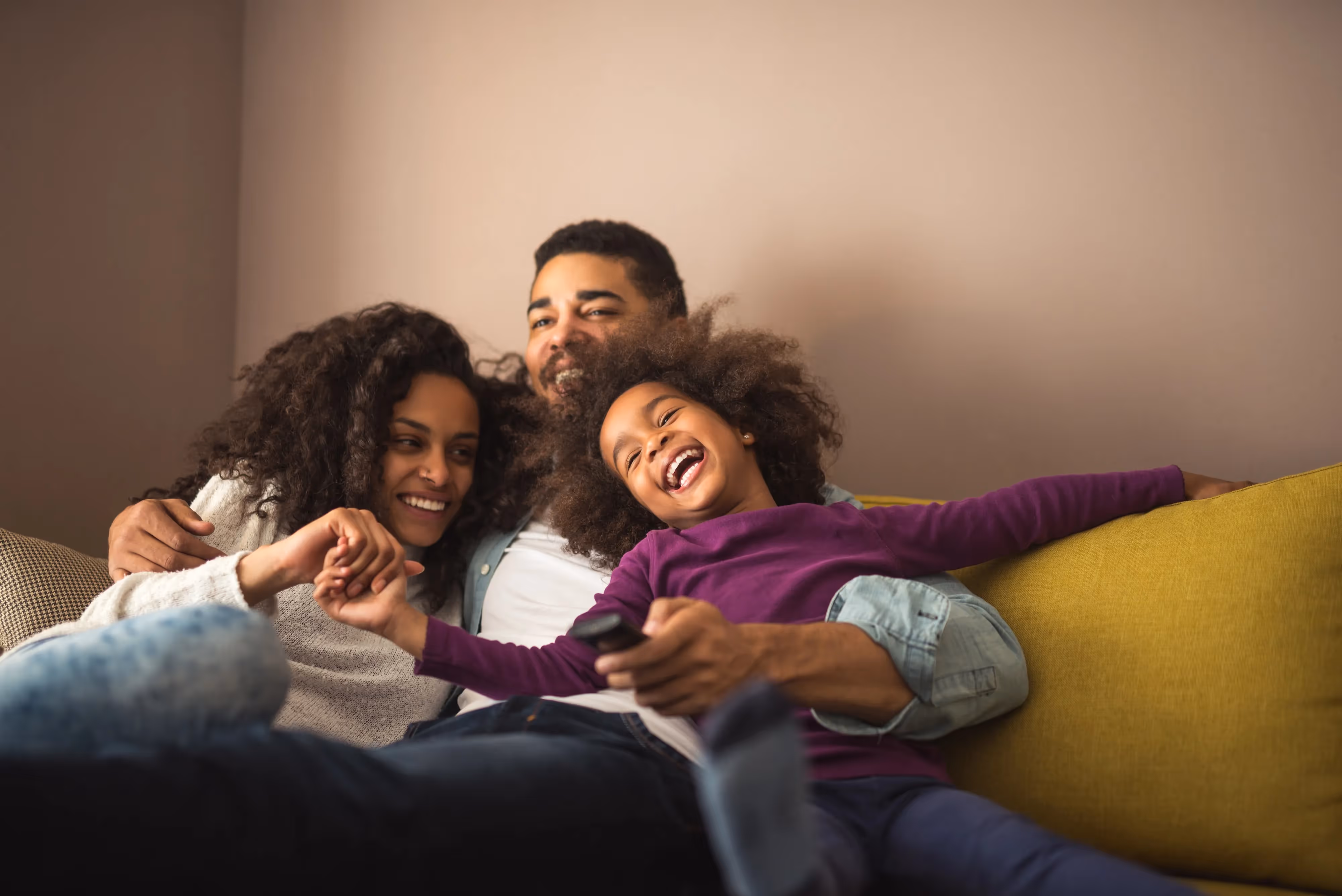 Family Relaxing on Couch Stock Photo