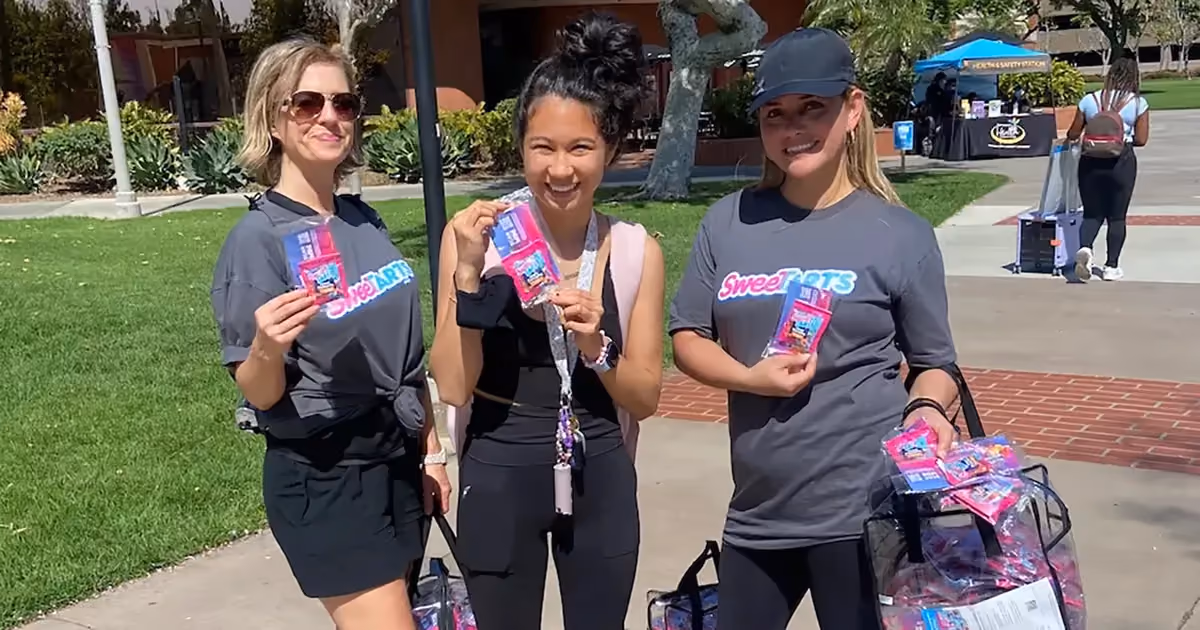 women holding sweet tarts samples