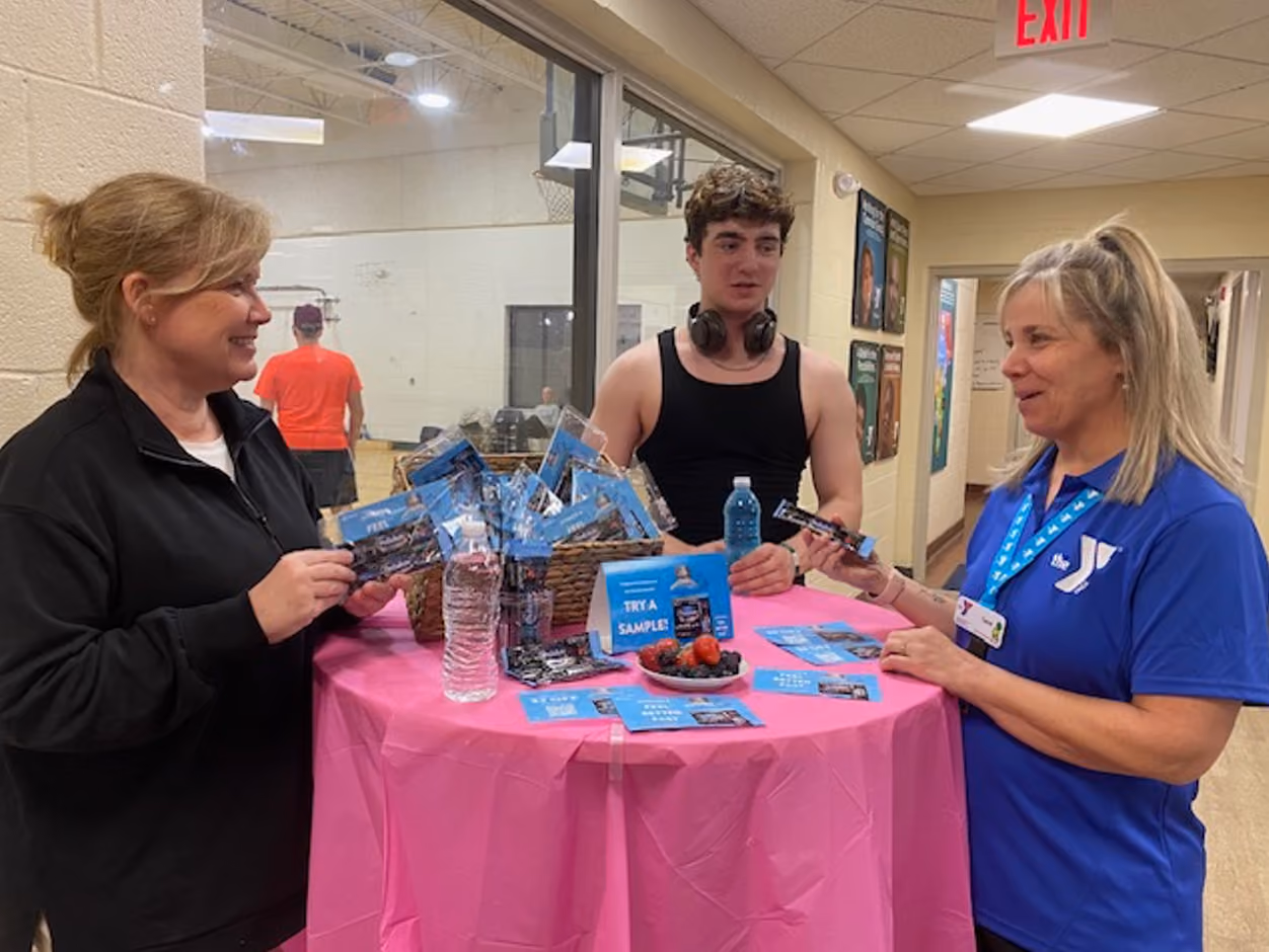 two woman and a man for pedialyte samples