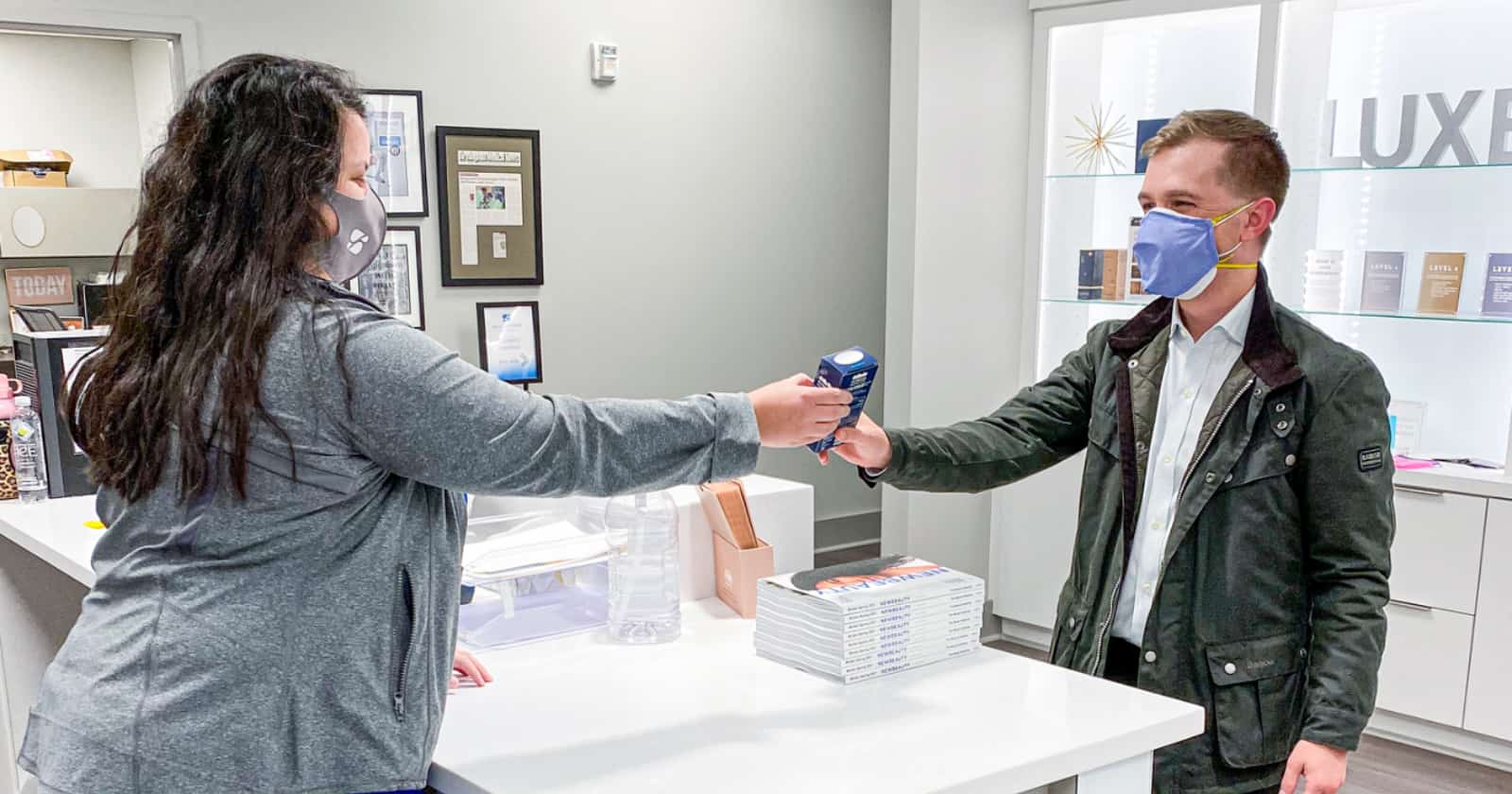 woman handing out product samples 