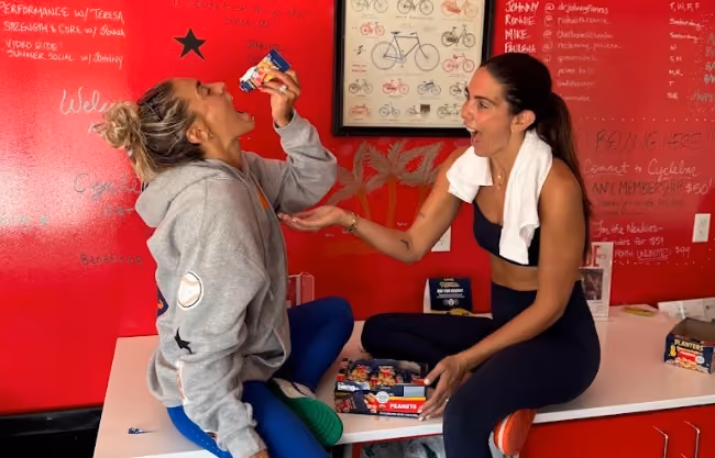 woman eating planters peanuts samples
