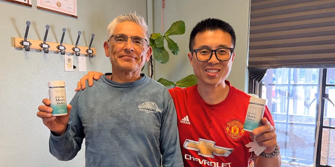 two men holding best nest product