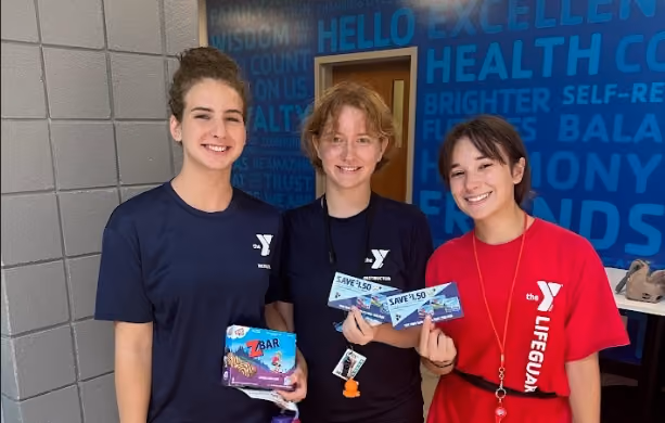 three people holding clifzbars samples