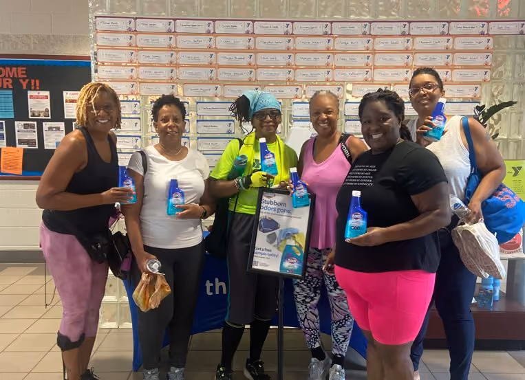 women holding clorox samples
