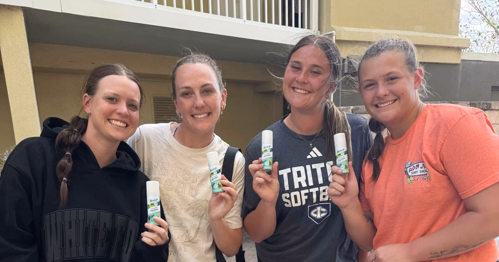 softball girl-team holding batiste samples