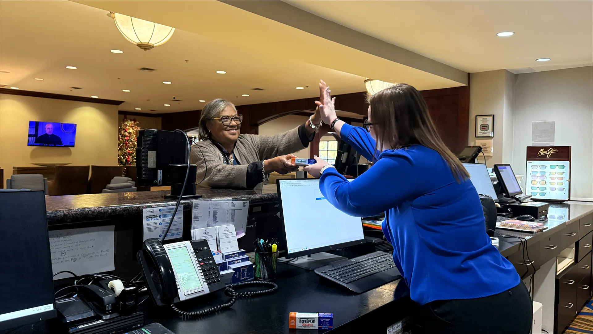 woman handing out therabreath sample
