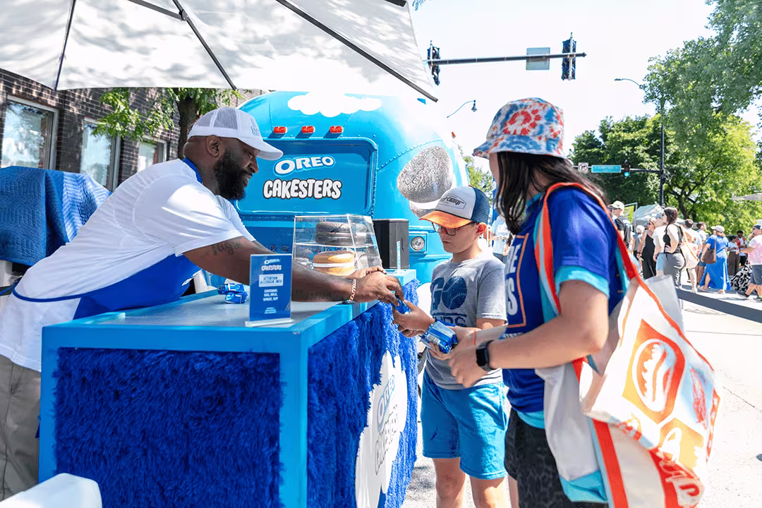 man giving out oreo  cakesters sample