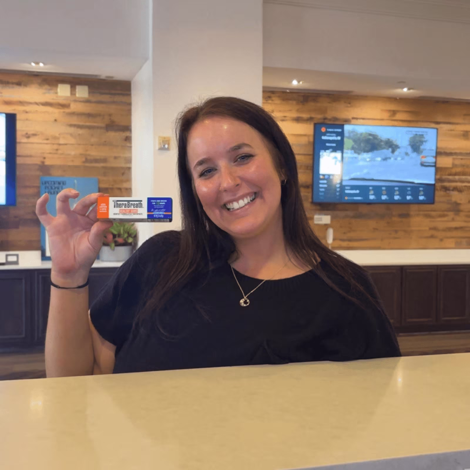 woman holding therabreath sample