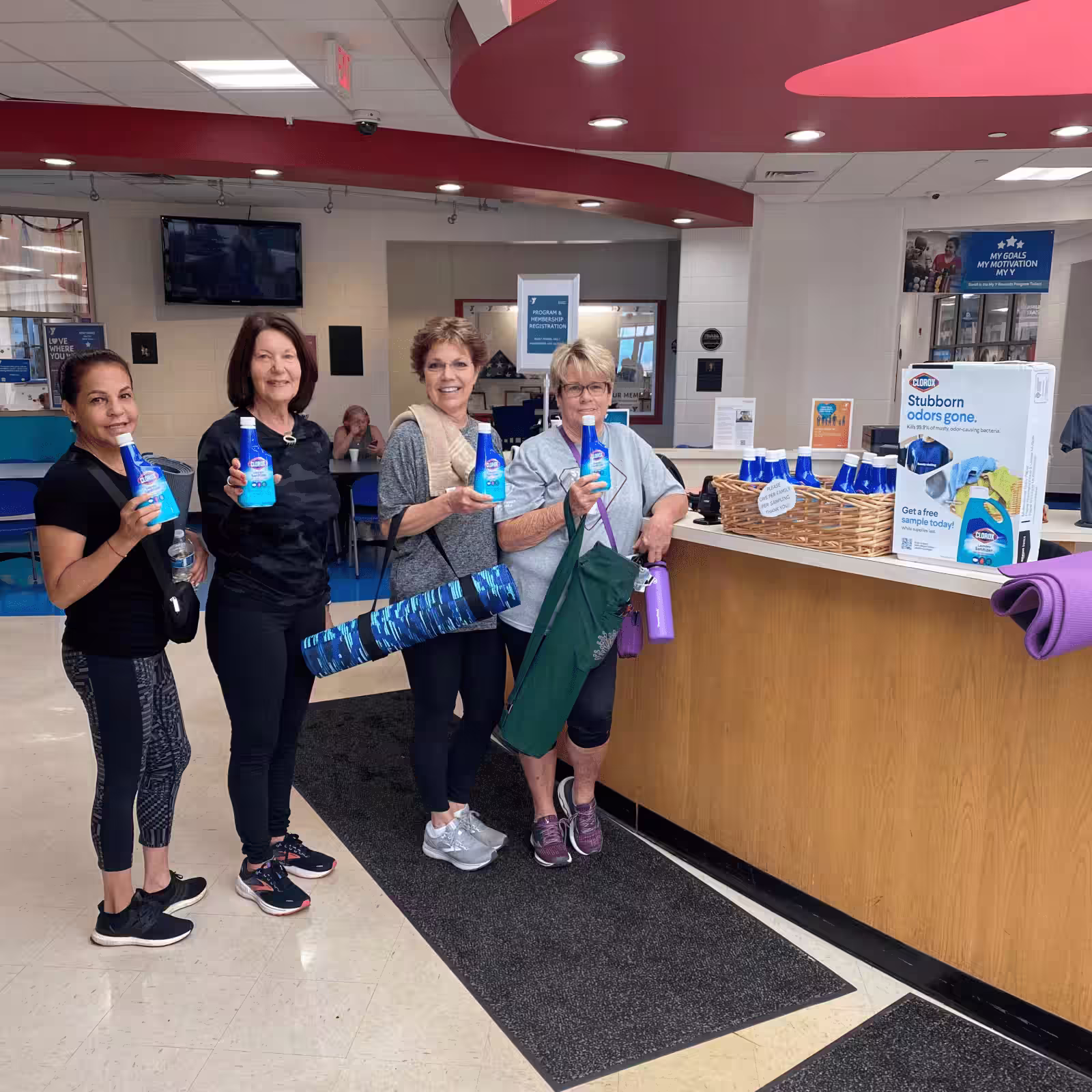 four women holding clorox samples