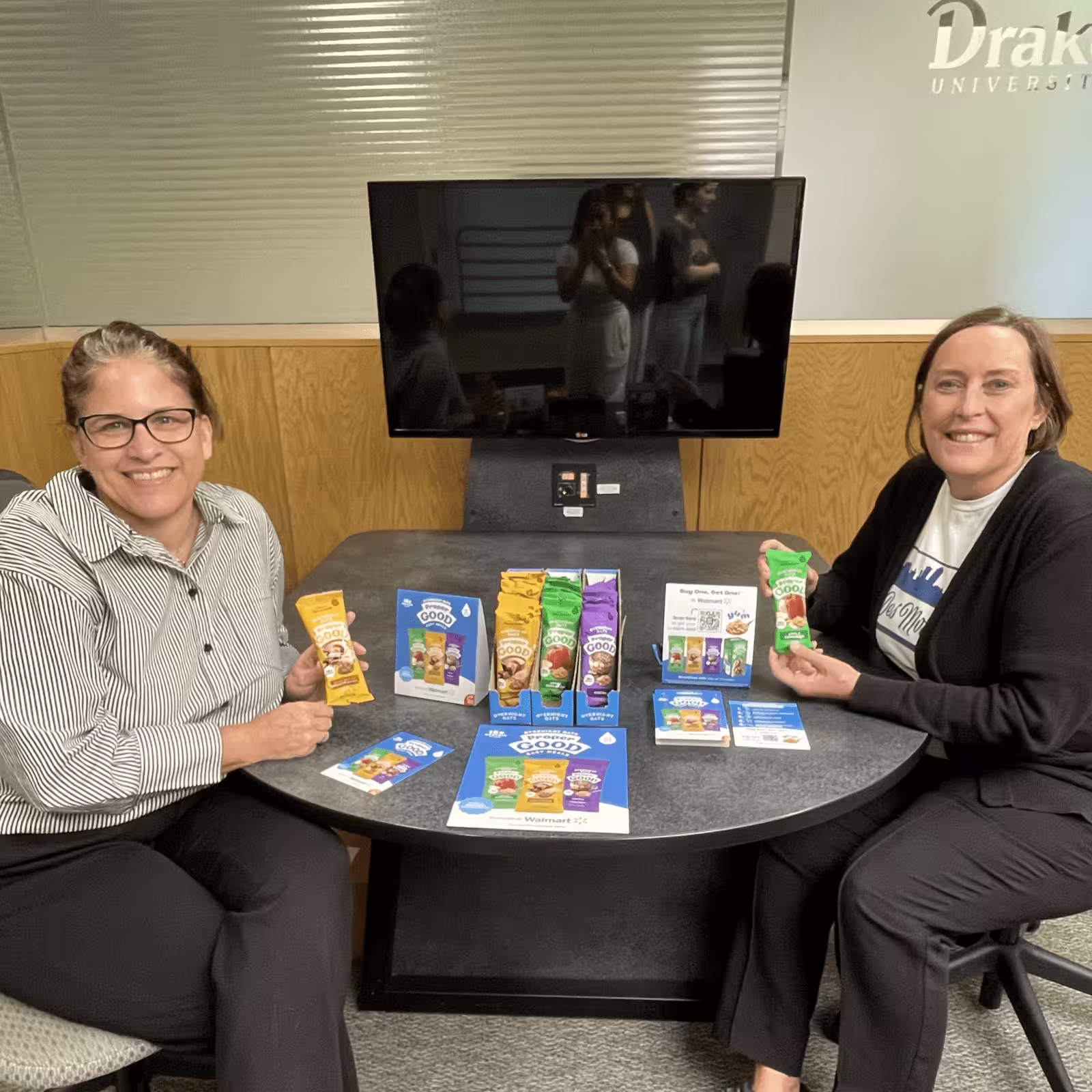 two women holding proper good samples