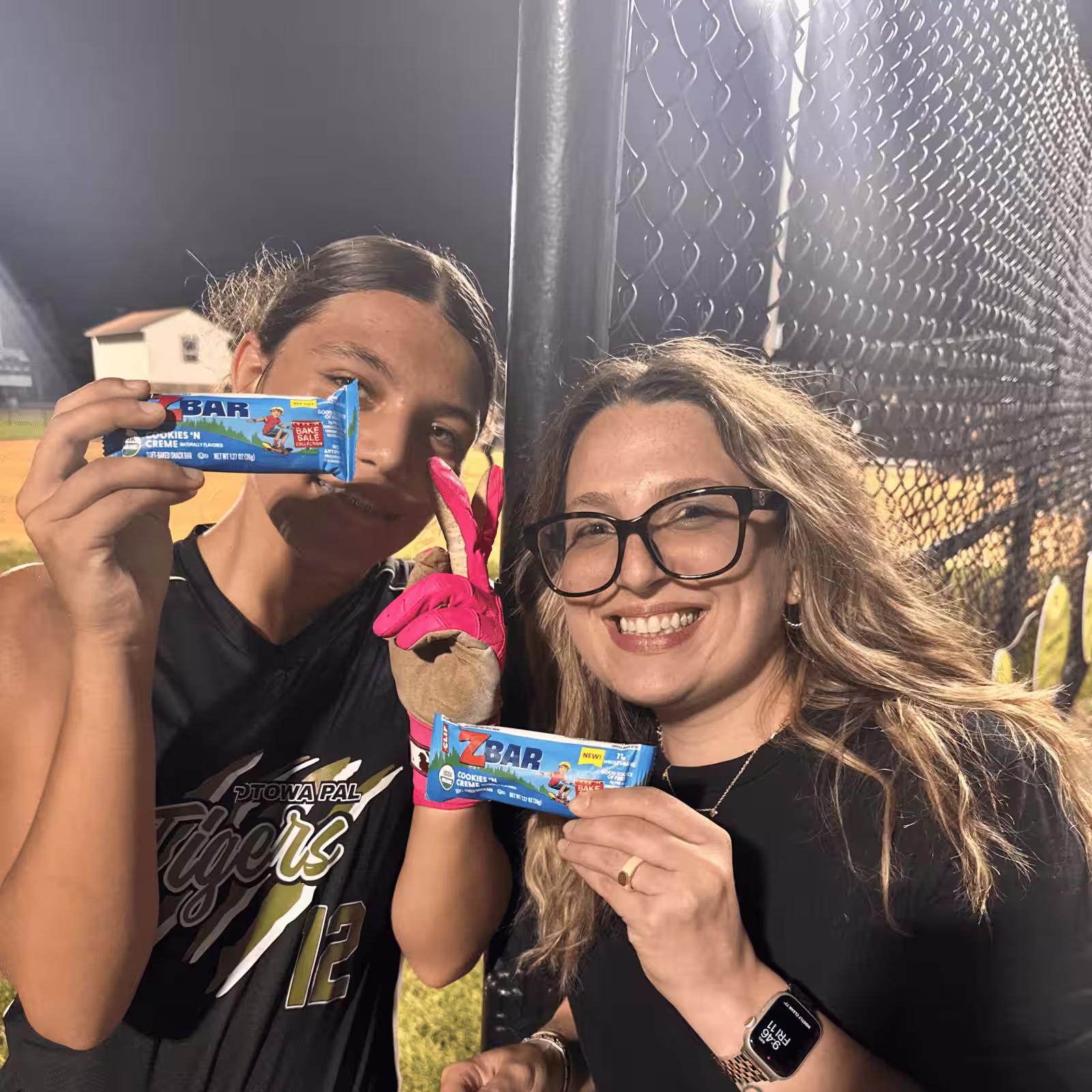 two women holding CLIF zbar samples