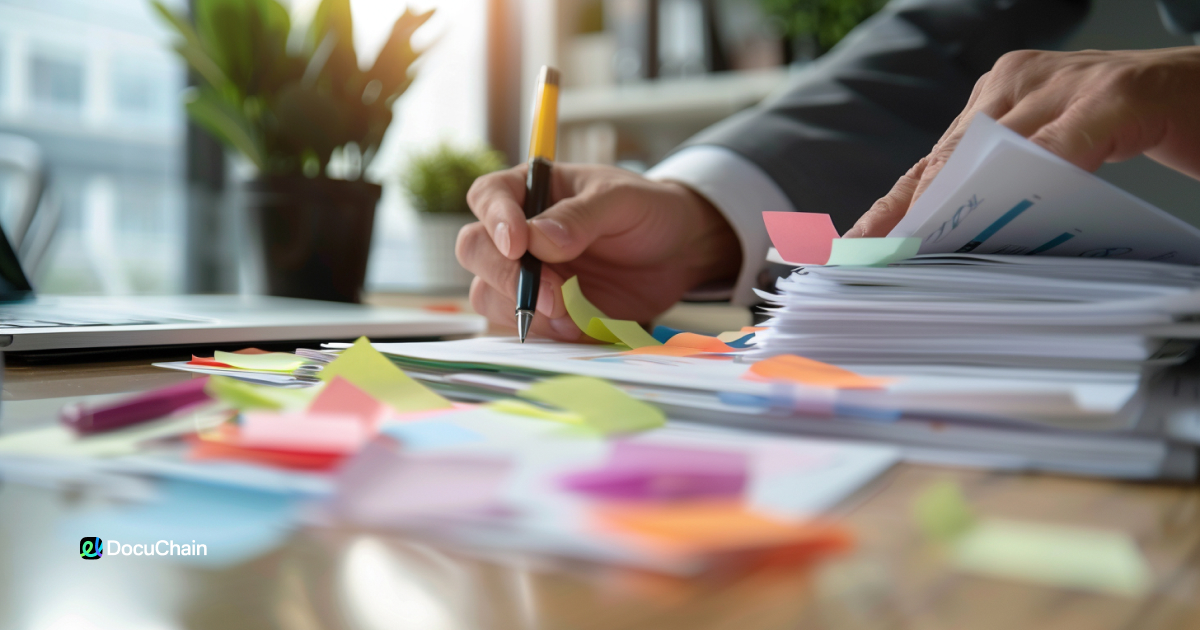Manager overwhelmed by paperwork and sticky notes during manual onboarding process, highlighting the need for eSignature automation