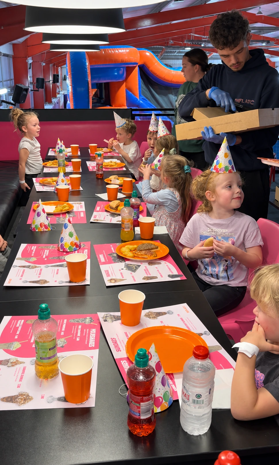 Children enjoying food and celebrations at an Inflato birthday party