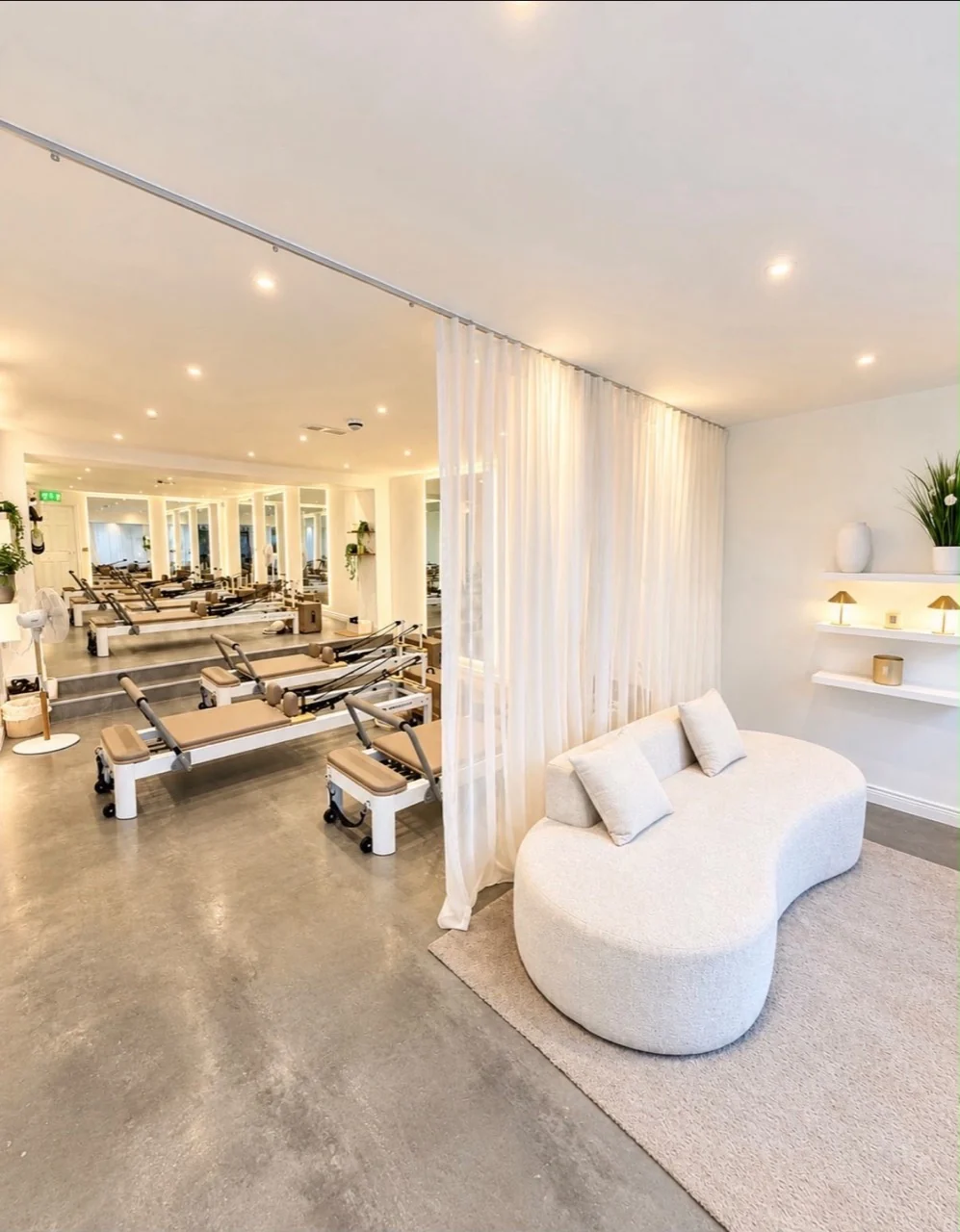 Platform Pilates Coleraine studio, with reformers and a curved sofa