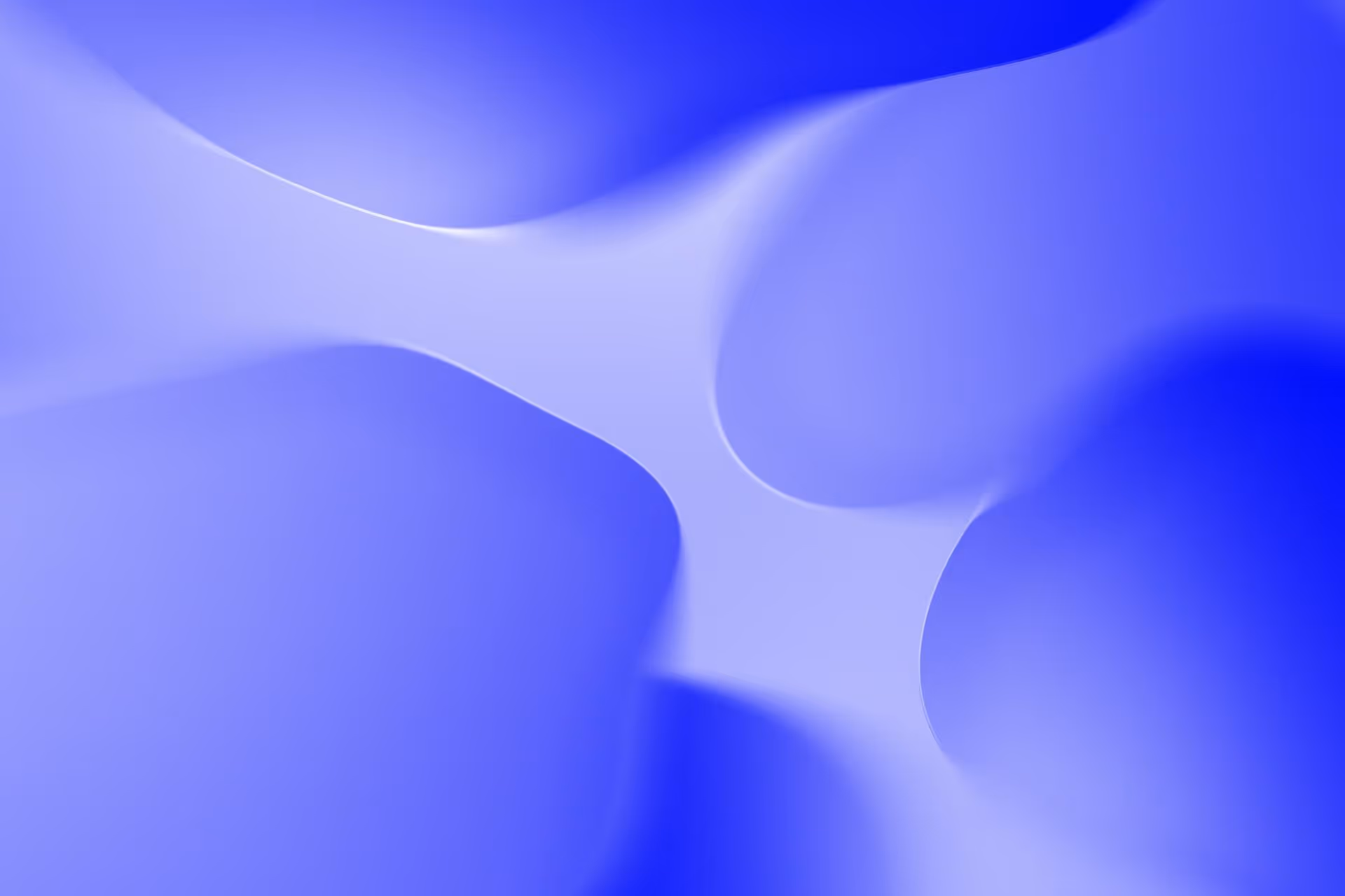 Abstract smooth shapes in varying shades of blue blending into each other.