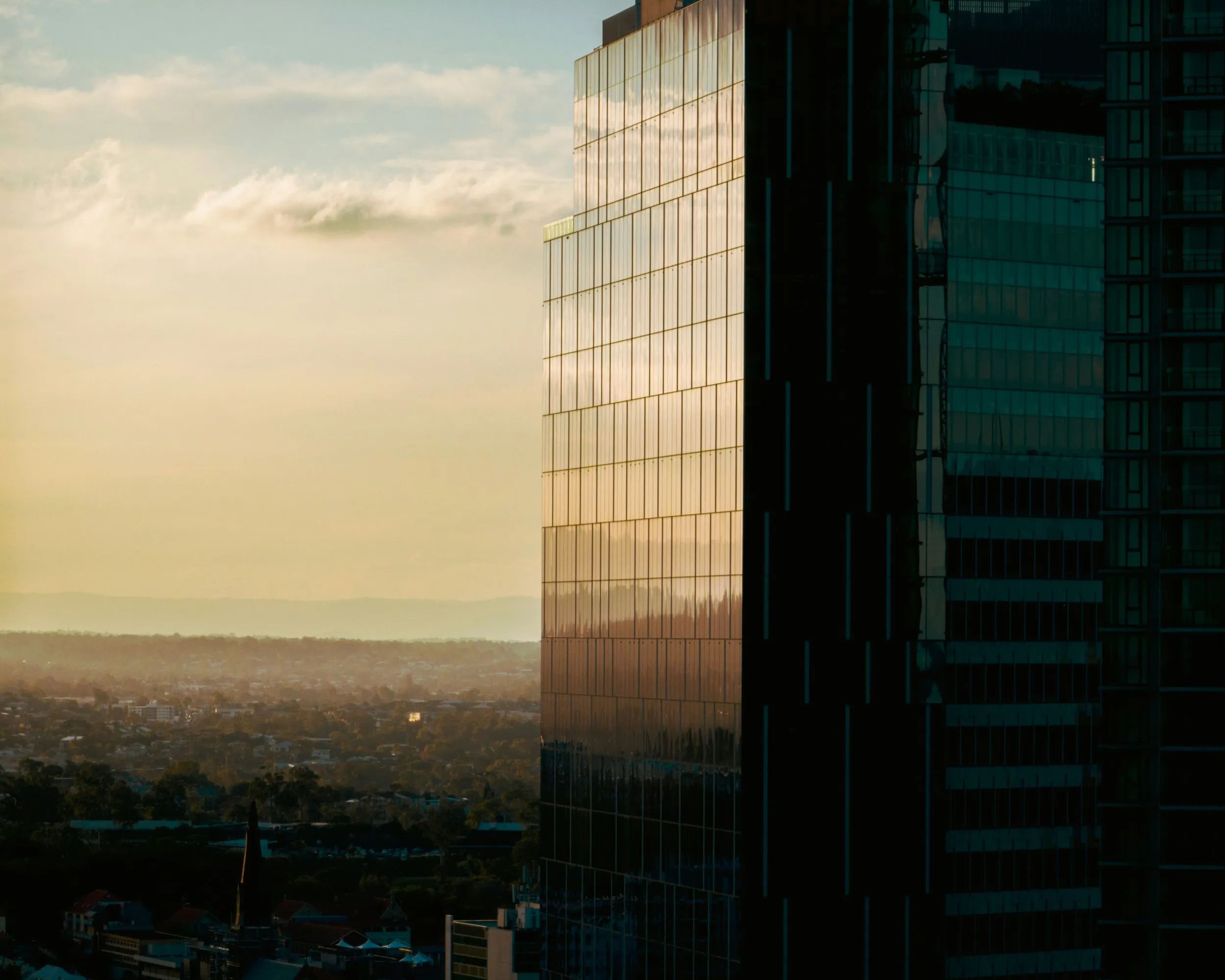 high rise building in sunset